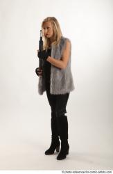 NIKOL STANDING POSE WITH SHOTGUN